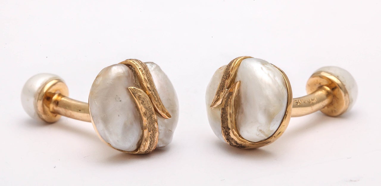 1950's 14kt Yellow Gold Stud set with Mississippi Mud Pearls.  Beautiful natural fresh water pearls entwined with a gold engraved cross over.  Perfect for any gentleman  Very luxurious.